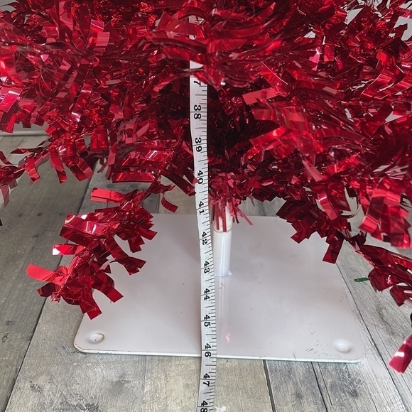 Red tinsel Christmas tree on a white metal base.  Approx 4’ tall. Light weight. - Picture 6 of 8
